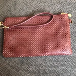 Laser cut wristlet crossbody from Charming Charlie
